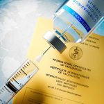 Vaccine in front of Covid-19 Vaccine Card