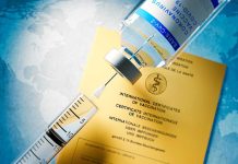 Vaccine in front of Covid-19 Vaccine Card