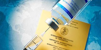 Vaccine in front of Covid-19 Vaccine Card