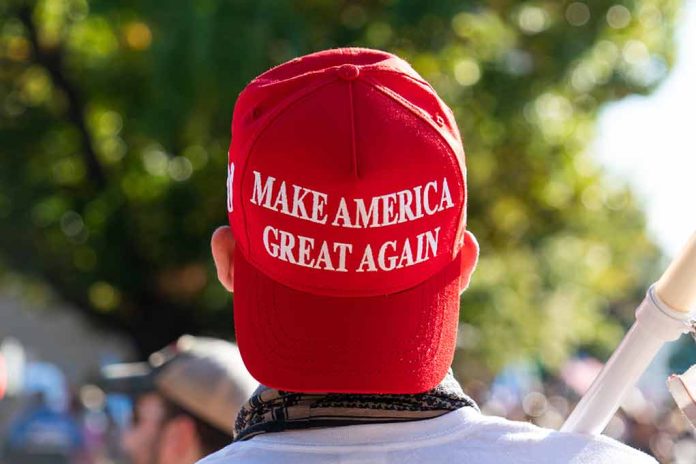 1850438311 featured image Red Make America Great Again hat on person head