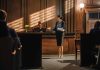 Woman speaking to judge in courtroom setting