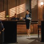 Woman speaking to judge in courtroom setting