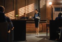 Woman speaking to judge in courtroom setting