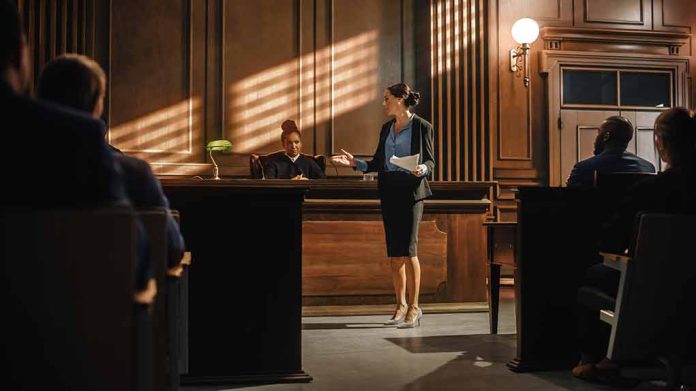 2056433831 featured image Woman speaking to judge in courtroom setting