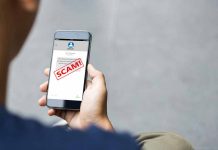Person reading a scam message on a smartphone