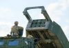 Soldier with military vehicle and missile launcher