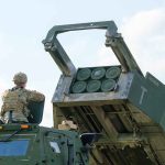 Soldier with military vehicle and missile launcher