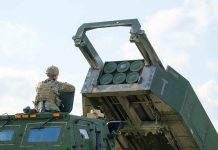 Soldier with military vehicle and missile launcher