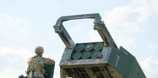 Soldier with military vehicle and missile launcher