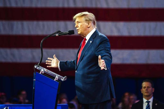 2455398299 featured image Person speaking at a podium with flag background