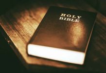 A Holy Bible on a wooden table