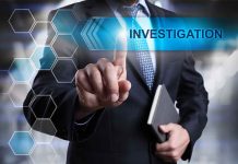Man in suit pointing at Investigation text