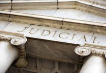 Marble columns with the word Judicial engraved above