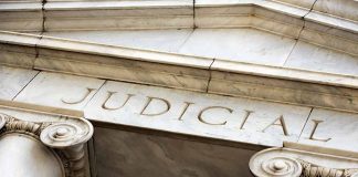 Marble columns with the word Judicial engraved above