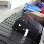 Suitcases on an airport baggage carousel