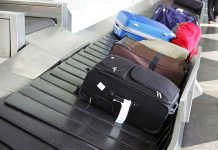 Suitcases on an airport baggage carousel