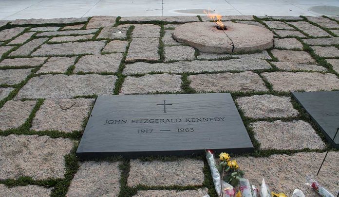90209500 featured image Gravestone with eternal flame and flowers nearby