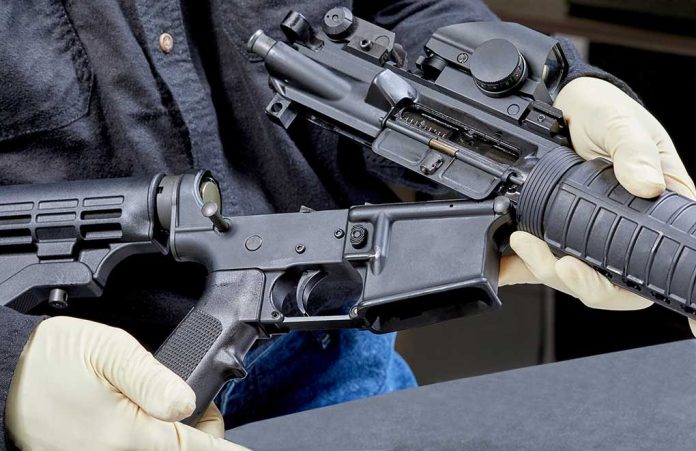 1088730455 featured image Person assembling a black rifle with gloves on