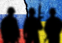 Silhouetted soldiers with Russian and Ukrainian flag backgrounds