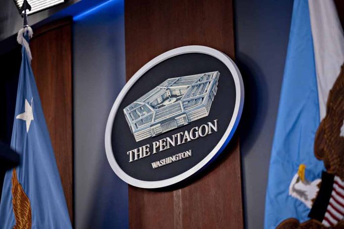 The Pentagon emblem between two flags
