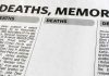 Newspaper obituary section with death notices