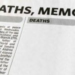 Newspaper obituary section with death notices