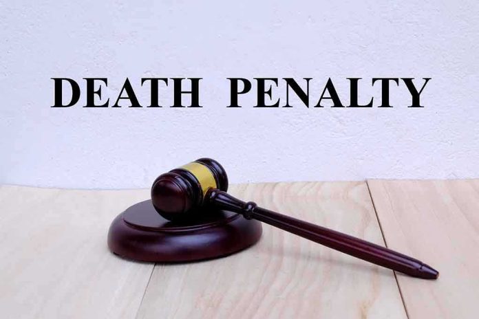 Gavel under "Death Penalty" text on white background. featured image Gavel under Death Penalty text on white background