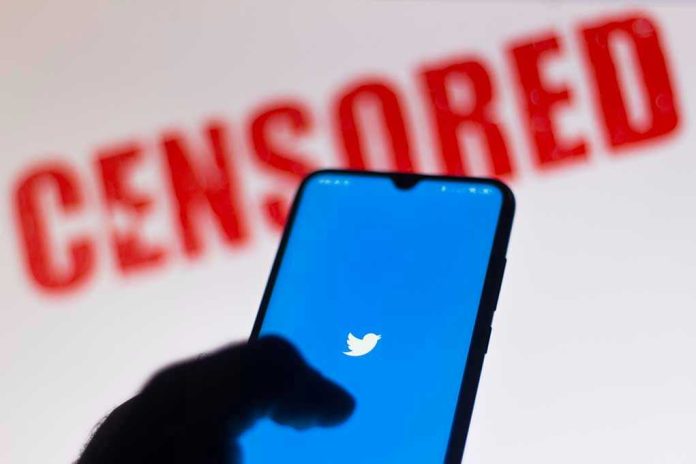 1756782404 Phone displaying Twitter app with CENSORED in background