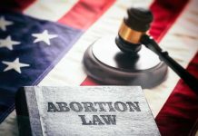Book titled Abortion Law gavel American flag background