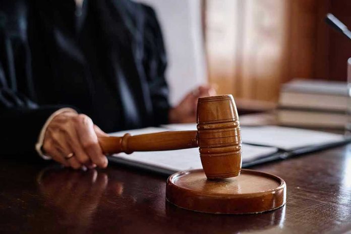 Judge holding gavel in courtroom