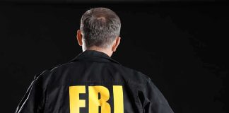FBI agent with back facing the camera