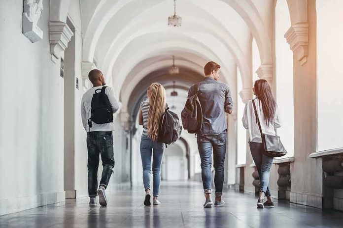685407808 featured image Four students walking in a corridor together
