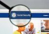 Magnifying glass focusing on Social Security Administration webpage