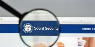 Magnifying glass focusing on Social Security Administration webpage