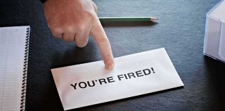 Envelope with YOU ARE FIRED and pointing finger