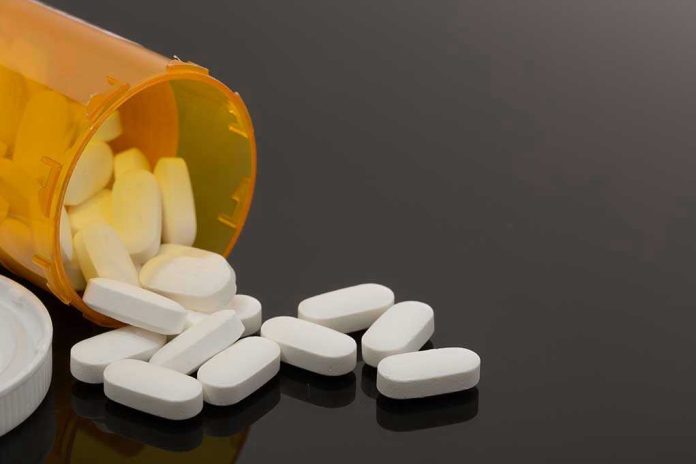 757565809 Spilled prescription bottle with white pills