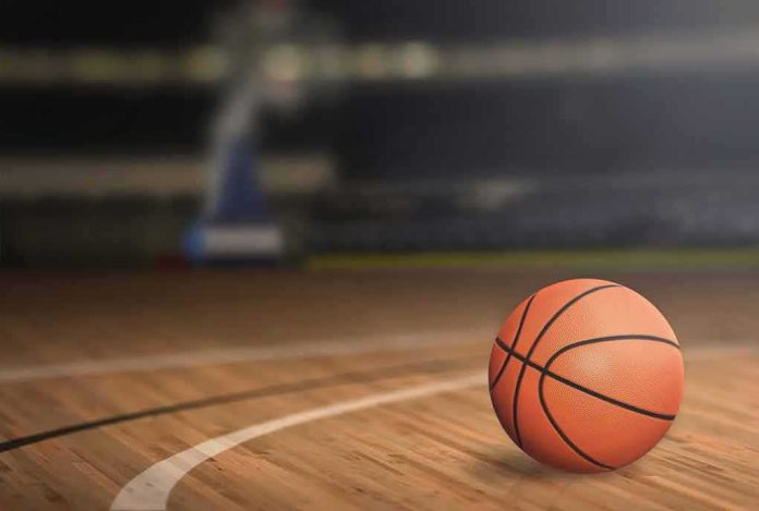 shutterstock_377181817.jpg A basketball on a wooden court