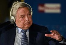 Elderly man speaks with headset and gestures.