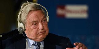 Elderly man speaks with headset and gestures.