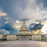US Capitol building with dramatic cloudy sky
