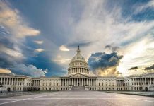 US Capitol building with dramatic cloudy sky