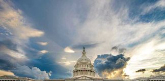 US Capitol building with dramatic cloudy sky