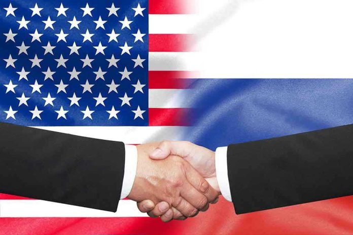 474374455 Hands shaking in front of USA and Russia flags