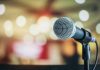 Microphone with blurred lights in the background.