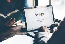 Laptop on Google homepage, person reading a book.