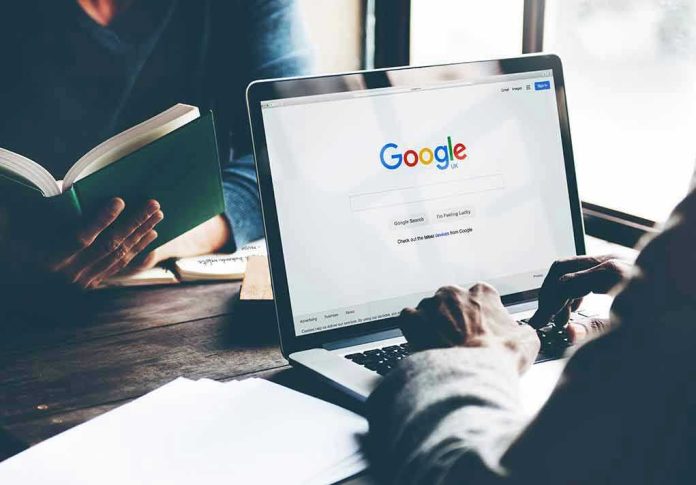 Laptop on Google homepage, person reading a book.