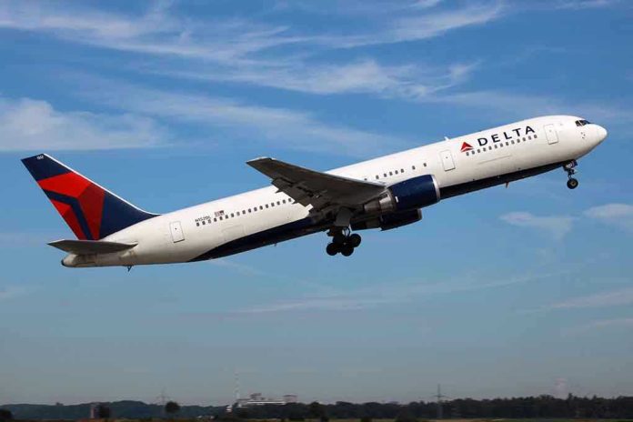 97178177 Delta airplane taking off from runway.