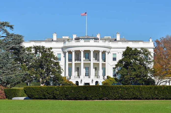 shutterstock_119809810.jpg The White House with the American flag flying in front