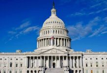 STUNNER: Senate Blocks Pay, Cashes Their Own! US Capitol Building against blue sky.