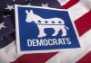 Democrats Block Worker Paychecks—Keep Their Own Democrats logo on American flag background